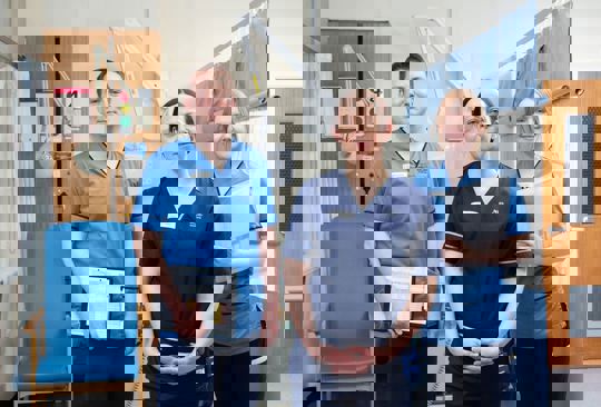 three NHS staff in uniform