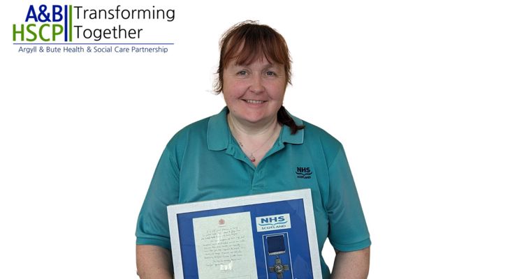 Karen Maclagan with the George Cross replica NHS Scotland award