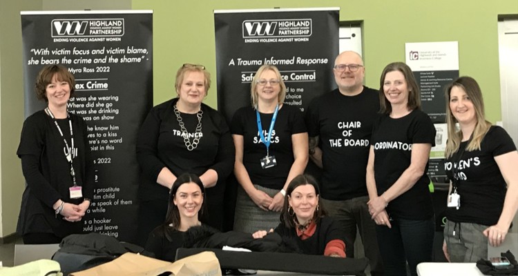 Highland Violence Against Women stall with volunteers